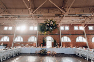 A large banquet hall with tables and chairs.