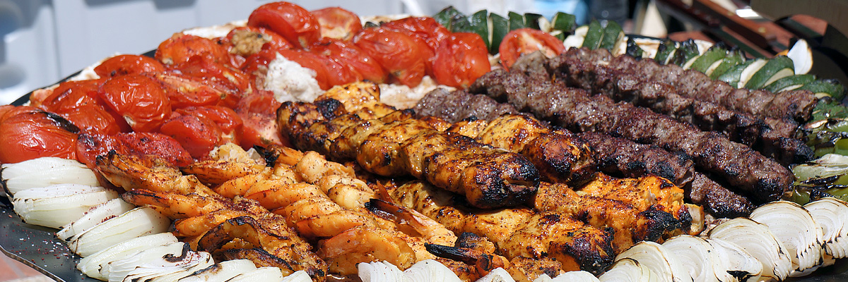 Platter of persian kebab with roasted vegetables